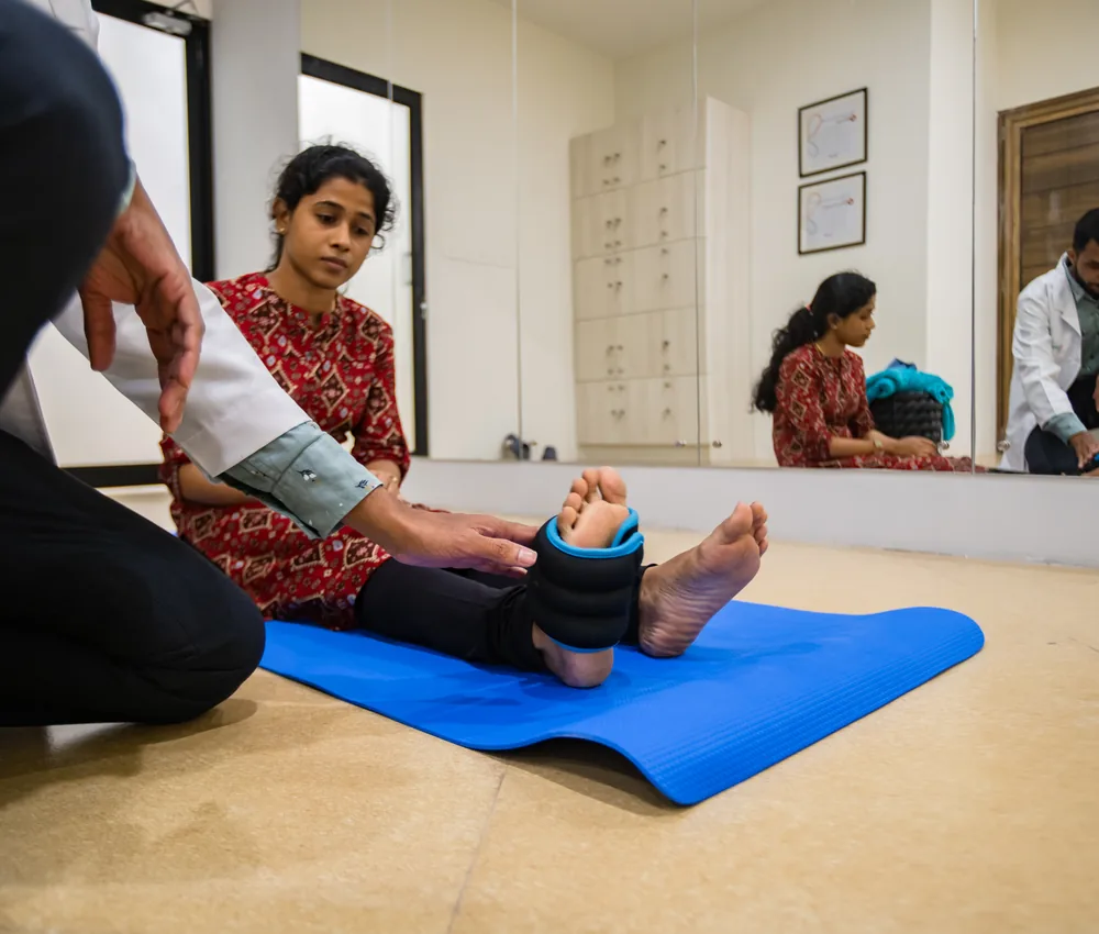 A physiotherapist guiding a patient through a rehabilitation exercise
