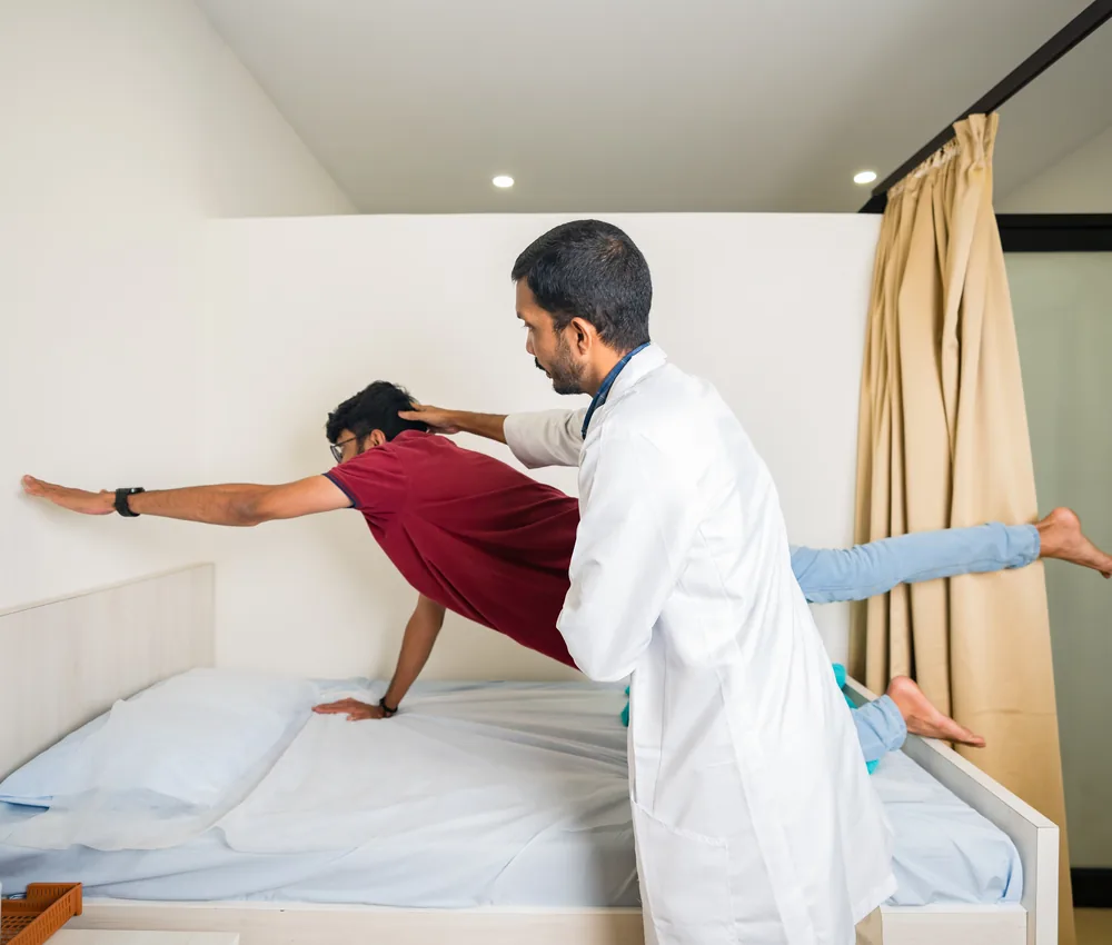 A physiotherapist guiding a patient through a rehabilitation exercise